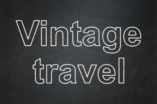 Travel concept: text Vintage Travel on Black chalkboard background
