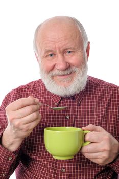 Cheerful and smiling handsome bald and bearded senior man with big green cup, isolated on white background