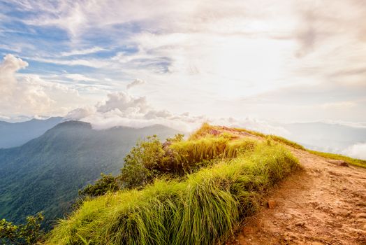 Beautiful landscape nature of high mountain colourful sunlight cloud and sky on Phi Pan Nam Range during sunset in winter from viewpoint Phu Chi Fa Forest Park at Chiang Rai Province Thailand