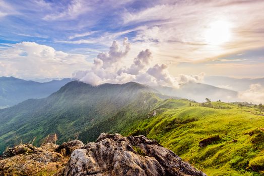 Beautiful landscape nature of high mountain cloud fog and sky on Phi Pan Nam Range during sunset in winter from viewpoint Phu Chi Fa Forest Park at Chiang Rai Province Thailand