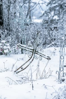 Old cemetery at abandoned  village in a winter day