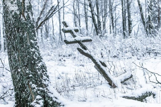 Old cemetery at abandoned  village in a winter day