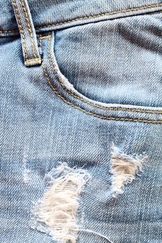 Fashion concept : Close up of women blue jeans detail with empty pocket