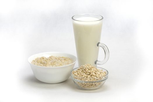 Bowl of oats porridge isolated on a white background Healthy breakfast