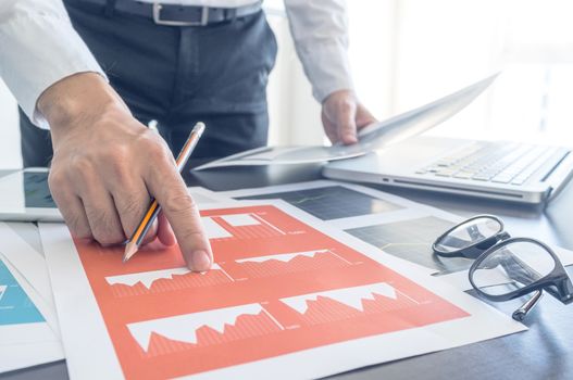 Business, office concept. Working process, Man discussing with financial document.