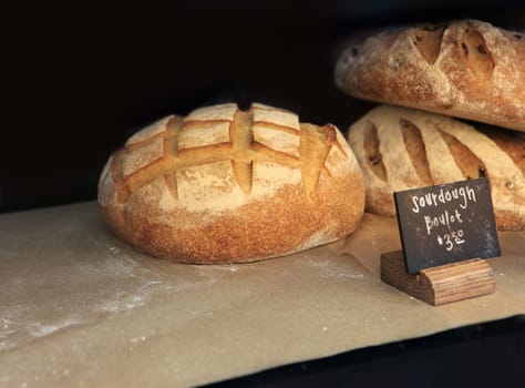 Freshly baked white bread on the counter of Market