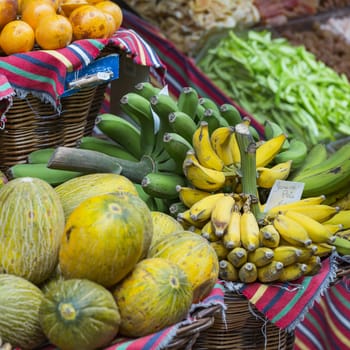 A lot of tropical fruits in outdoor market