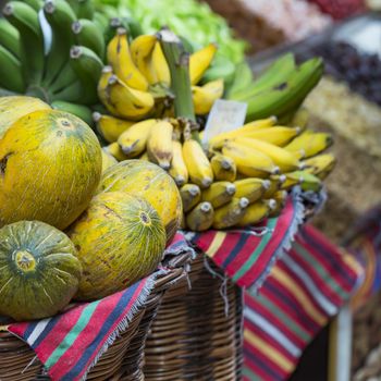 A lot of tropical fruits in outdoor market