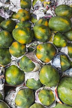 Fresh organic ripe papayas at a farmer's market in Kandy, Sri Lanka.