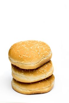 A pile of bread to make burgers on a white background