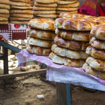 Kirghiz bread tokoch on Sunday market in Osh. Kyrgyzstan.