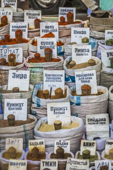 Vivid oriental central asian market with bags full of various spices in Osh bazar in Bishkek, Kyrgyzstan.