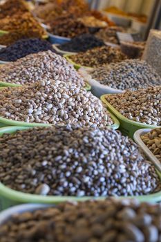 Spices and vegetables in bags at local bazaar in Osh. Kyrgyzstan.