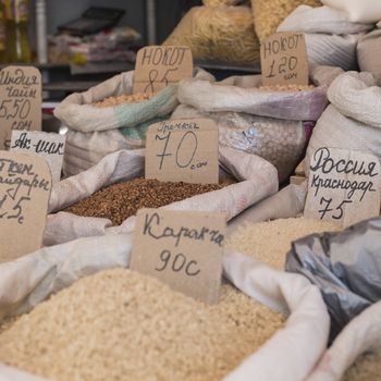 Spices and vegetables in bags at local bazaar in Osh. Kyrgyzstan.