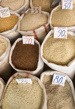 Spices and vegetables in bags at local bazaar in Osh. Kyrgyzstan.