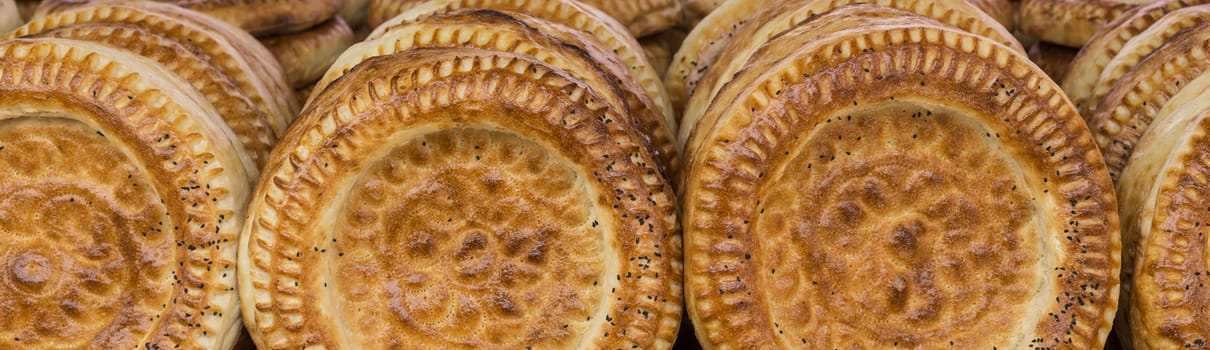 Kirghiz bread tokoch on Sunday market in Osh. Kyrgyzstan.