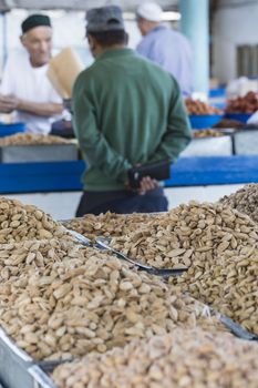 Spices and vegetables in bags at local bazaar in Osh. Kyrgyzstan.