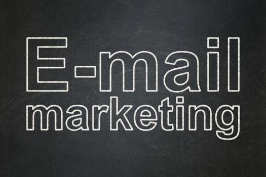 Marketing concept: text E-mail Marketing on Black chalkboard background