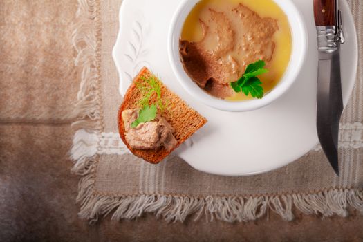 Home made chicken liver pate on a wooden surface