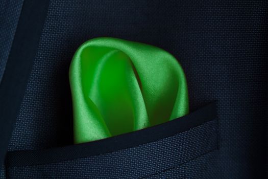 lose up of a green handkerchief in a jacket pocket