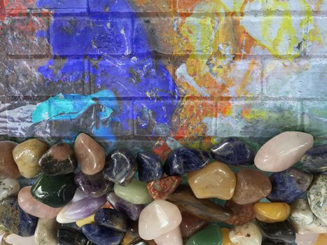 Background of various beautiful gemstones on painting wall decoration texture.
