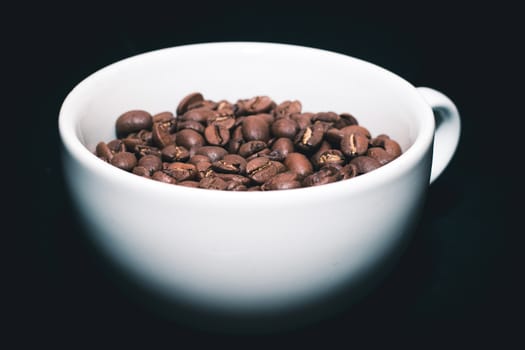 close up Coffee beans in white cup