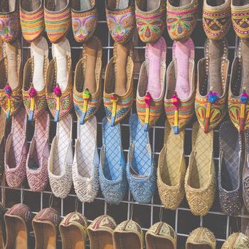 Rows of typically oriental shoes at the market in Dubai