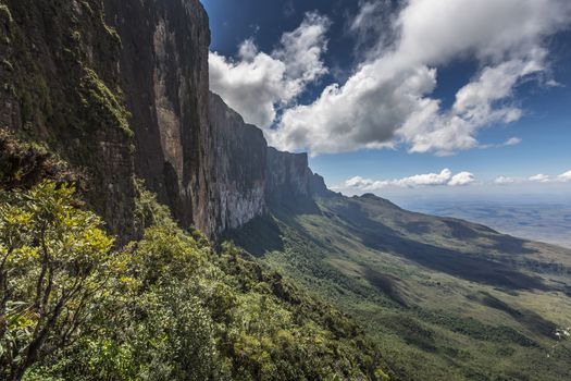 Trail down from the plateau Roraima passes under a falls - Venezuela, South America

