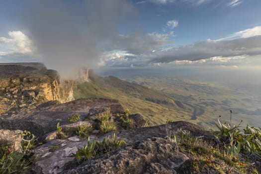 Trail down from the plateau Roraima passes under a falls - Venezuela, South America

