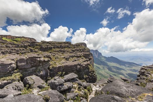 Trail down from the plateau Roraima passes under a falls - Venezuela, South America

