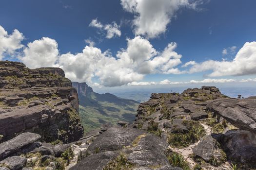 Trail down from the plateau Roraima passes under a falls - Venezuela, South America

