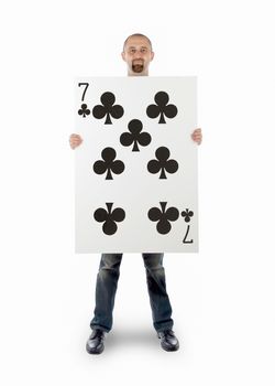 Businessman with large playing card - Seven of clubs