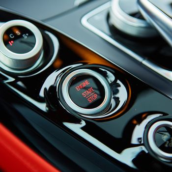 Start stop engine modern new car button.