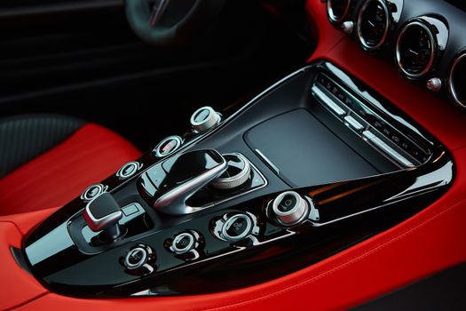 Detail of modern car interior, gear stick, automatic transmission in expensive car