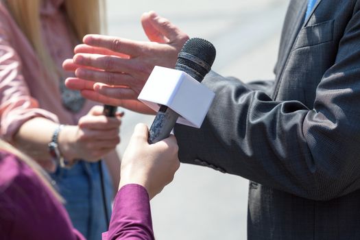 Journalist making interview with businessman or politician