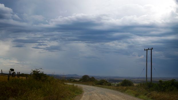 Thunder clouds in the sky on the road trip.