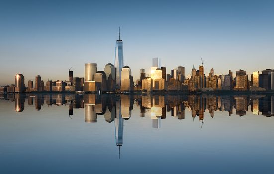 New York City skyline with urban skyscrapers at sunset, USA.