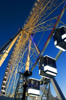 Cabins of Ferris Wheel and clear blue sky