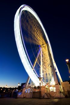 Big luminous ferris wheel in Paris, France