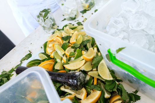 Fresh chopped ingredients for a refreshing cocktail with ice