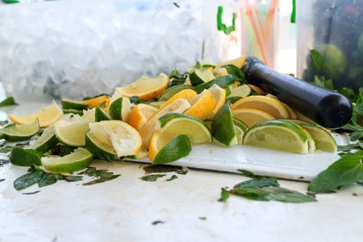 Fresh chopped ingredients for a refreshing cocktail with ice