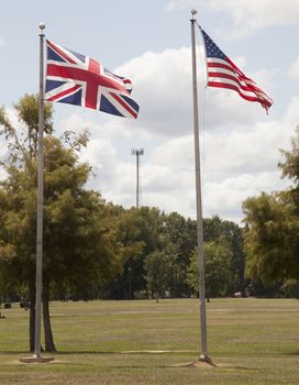 British and American flags flapping proudly in the wind
