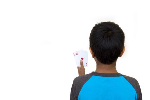 kid holding poker cards on a light background