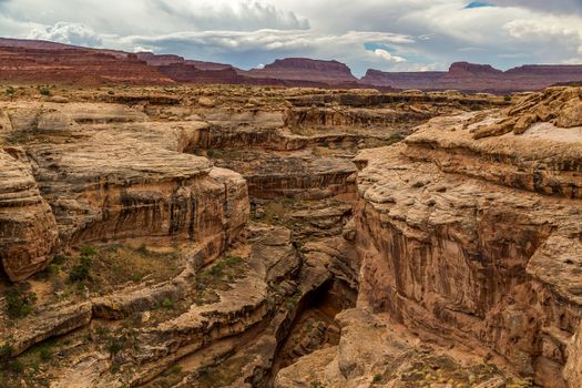 A slot canyon is a narrow canyon, formed by the wear of water rushing through rock. A slot canyon is significantly deeper than it is wide. Southern Utah has the densest population of slot canyons in the world with over one-thousand slot canyons in the desert lands south of Interstate 70.