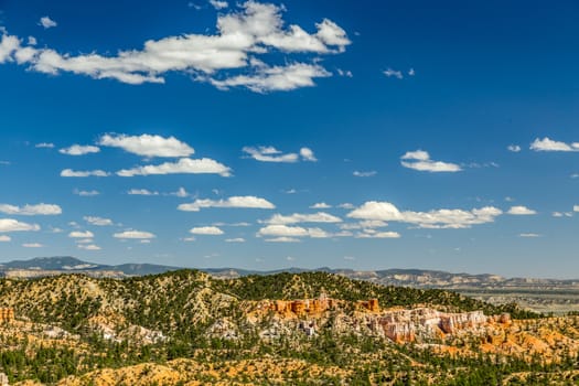 Bryce Canyon National Park, a sprawling reserve in southern Utah, is known for crimson-colored hoodoos, which are spire-shaped rock formations.