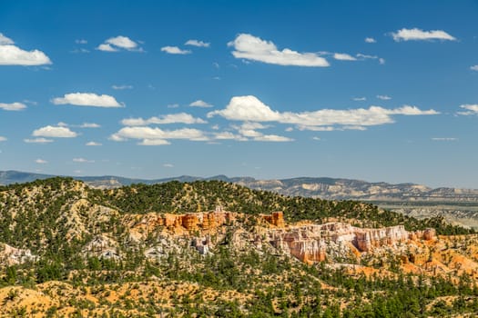 Bryce Canyon National Park, a sprawling reserve in southern Utah, is known for crimson-colored hoodoos, which are spire-shaped rock formations.