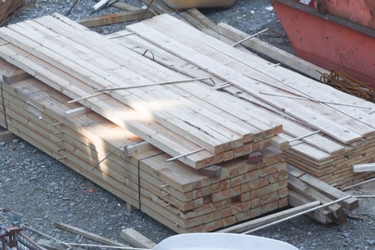 Stack of wooden beams and planks.