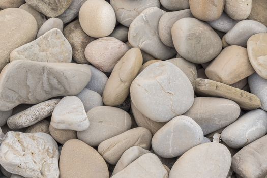Large amount rounded and polished beach rocks