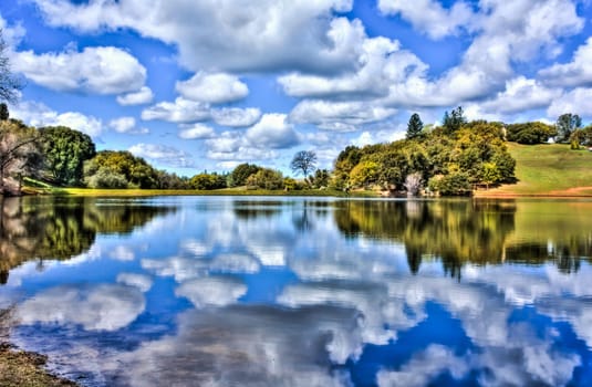 Reflection of Many White Clouds on the Lake