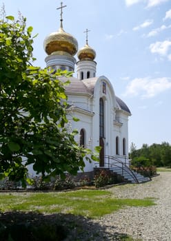 the Church with the Golden domes against the blue sky
